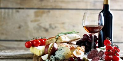 Wine, bread, cheese, sausage, fruit