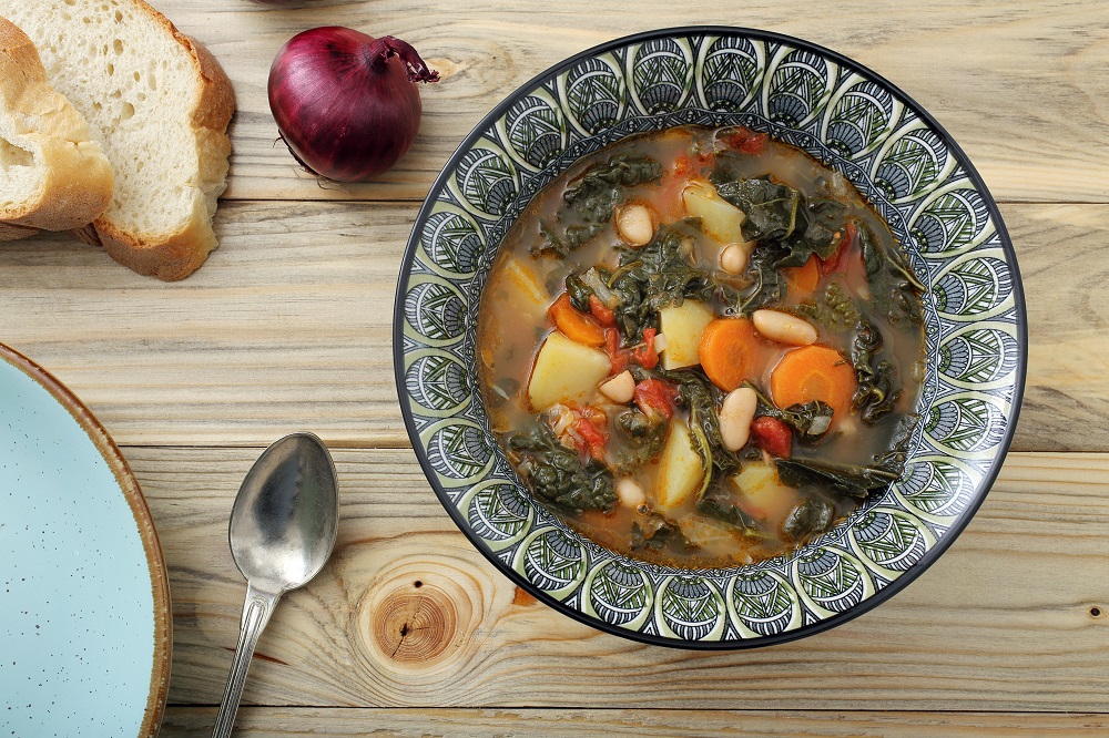 Tuscan Ribollita Soup with spoon and bread