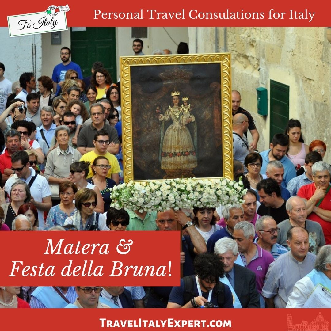 People walking with painting of the Blessed Mother in procession.