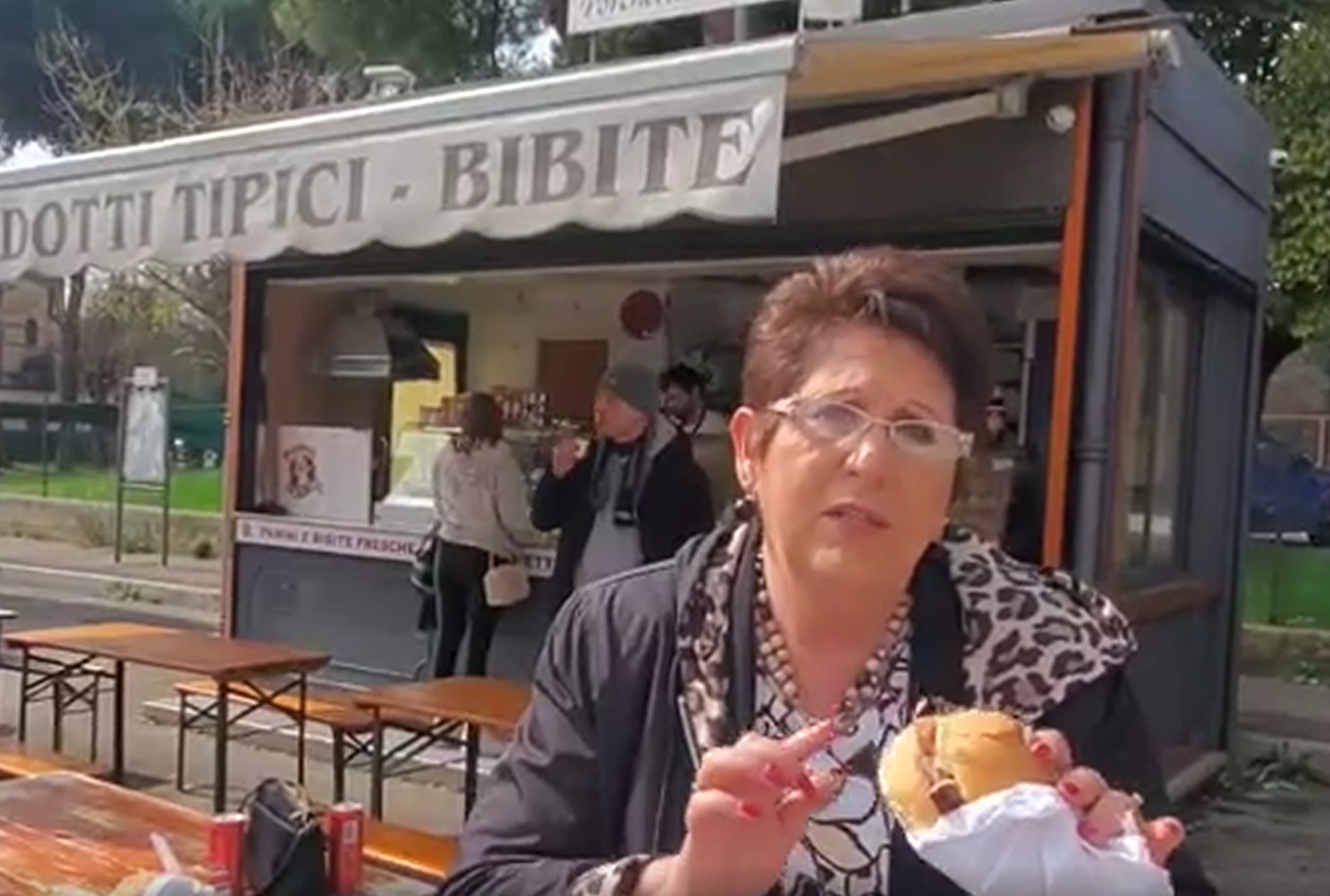 Teresa Tomeo at food stand in Assisi, Italy with Pork Sandwich.
