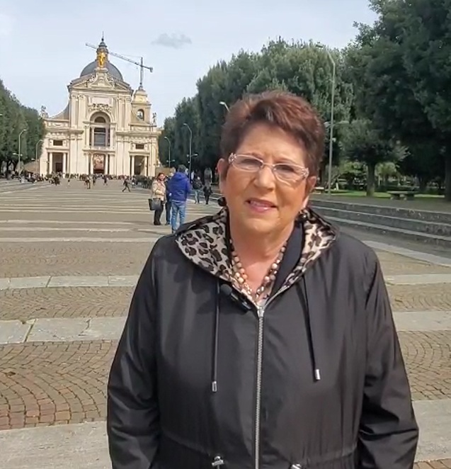 Teresa Tomeo standing in front of the Basilica of St. Mary of the Angels in Assisi, Italy.